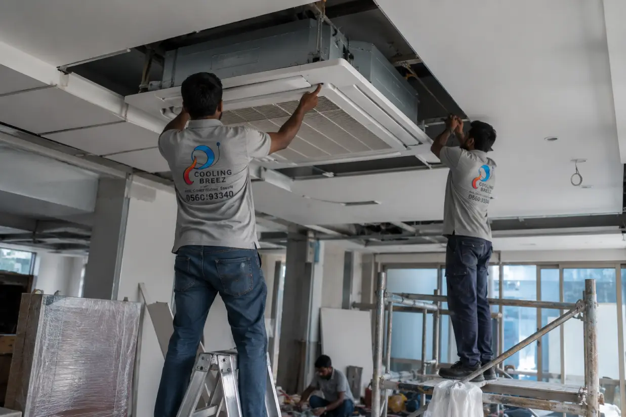 Cooling Breez HVAC technician performing AC maintenance in Saudi Arabia